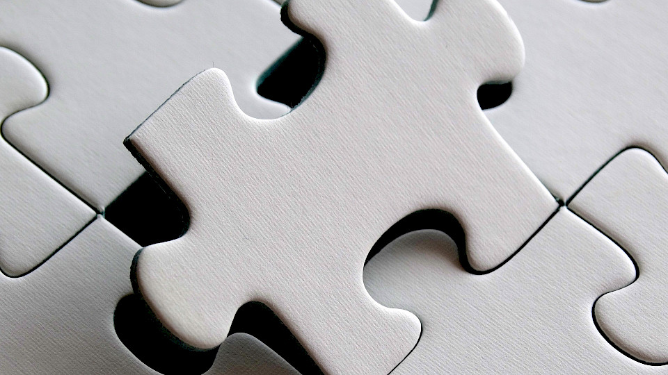the last piece of a puzzle is being inserted into the full composition